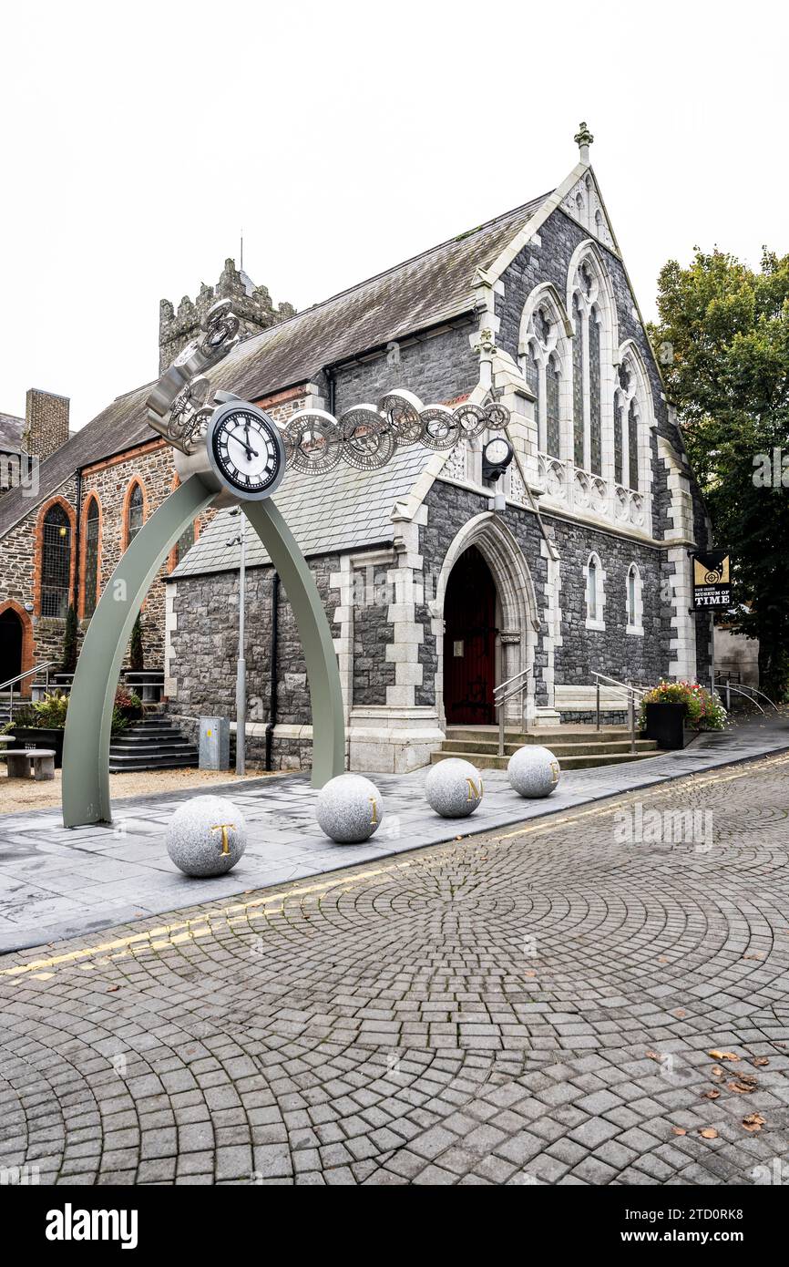 Exterior view of Irish Museum of Time and a contemporary sculpture with clocks, in Greyfriars Street, Viking Triangle, Waterford city center, Ireland Stock Photo