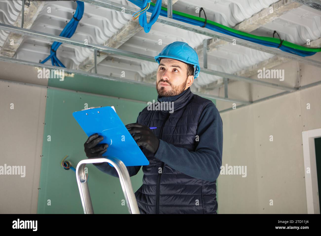 caucasian foreman checking the object Stock Photo