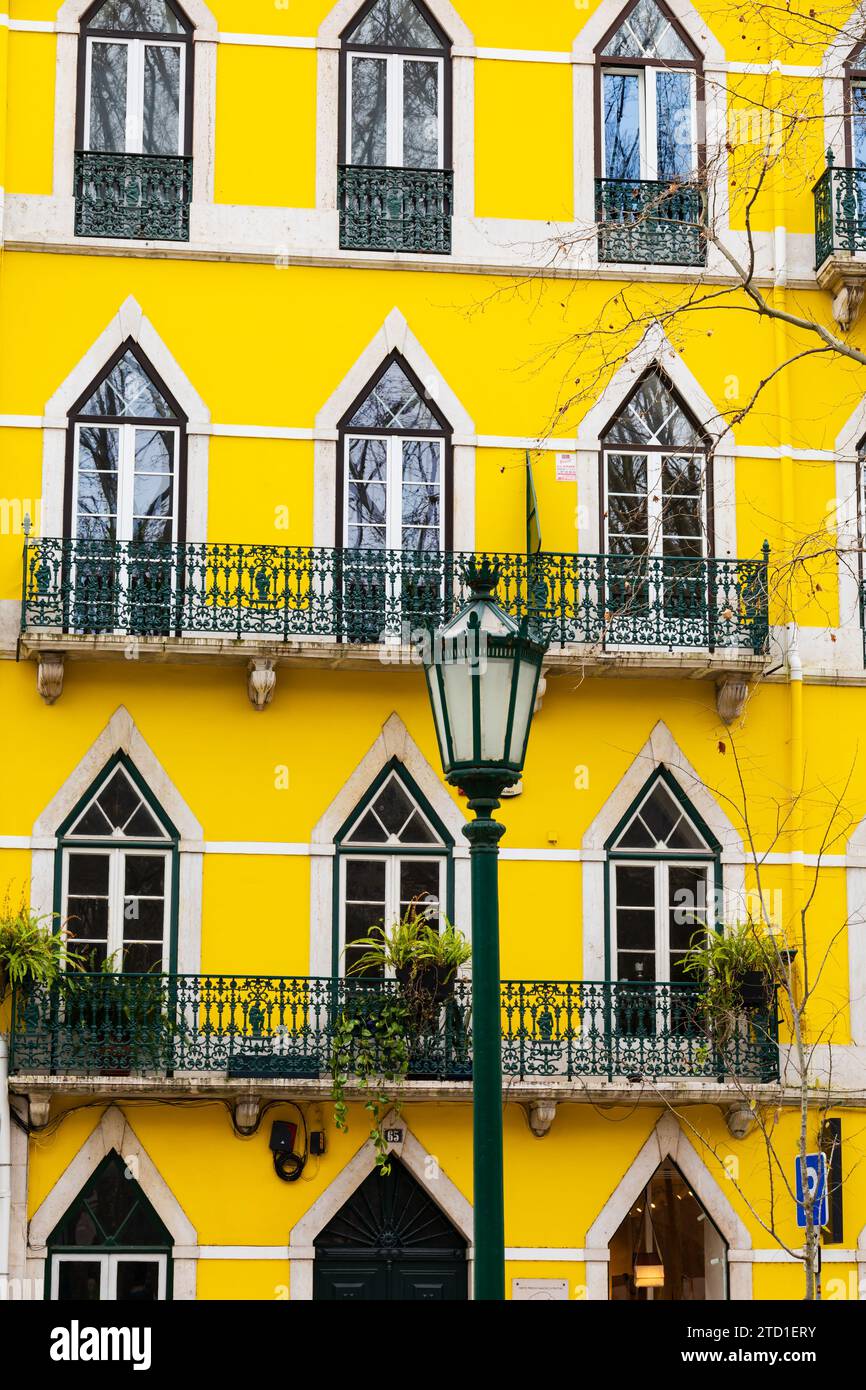 Bright yellow painted walls above the Claudie Pierlot shop on