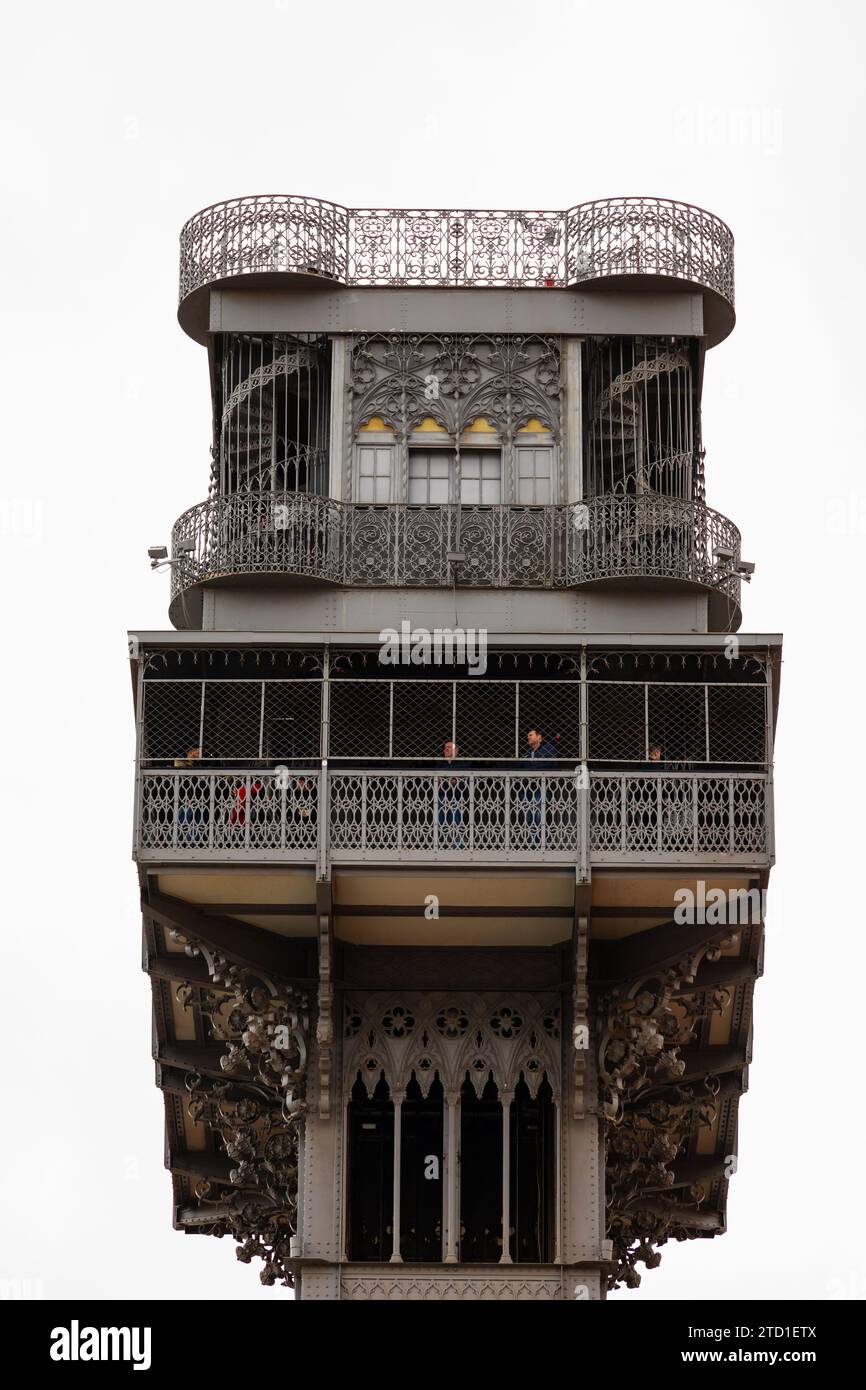 People look out from the the Elevador de Santa Justa, elevator veiwing platform. Lisbon, Portugal Stock Photo