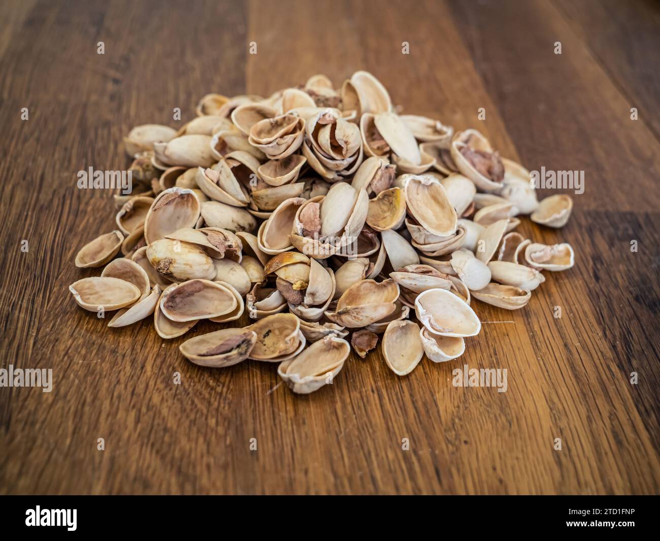 Large pile of empty pistachio shells eaten pistachios remains Stock