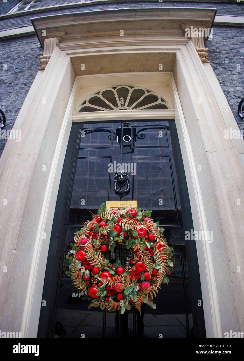 London, UK  15 Dec 2023 The door of Number 10 with the Wreath. The Downing Street Christmas tree outside the door of Number 10, the home of the British Prime Minister. Stock Photo