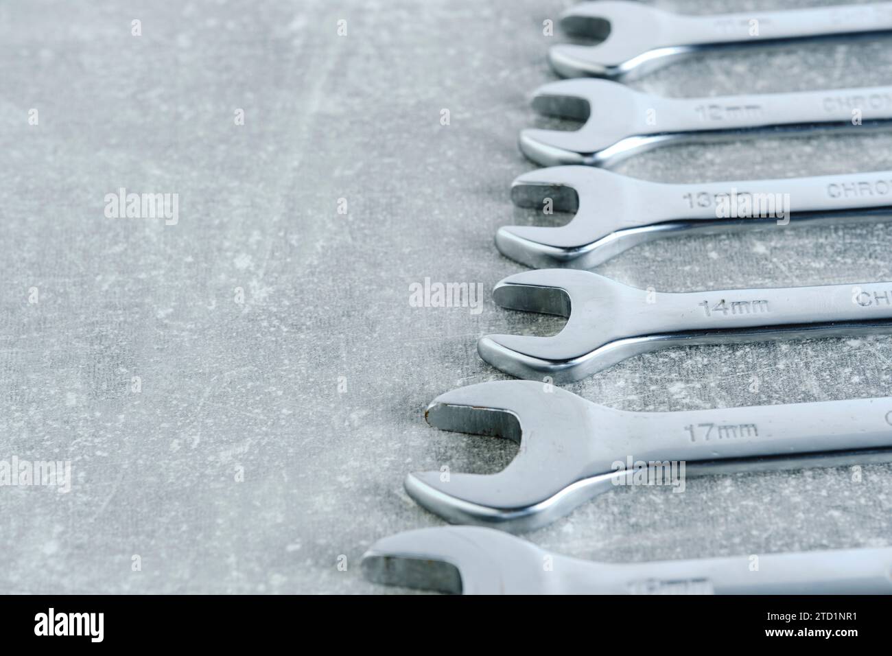 Set of wrenches gray concrete background Stock Photo