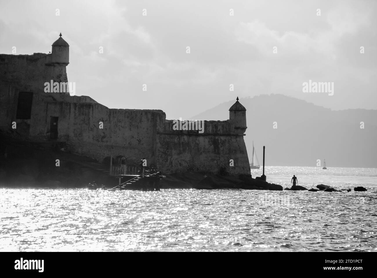 City of Guarujá, São Paulo, Brazil. Sunset at the Santo Amaro da Barra Grande Fortress. Museum located on the Port of Santos canal. BW image. Stock Photo