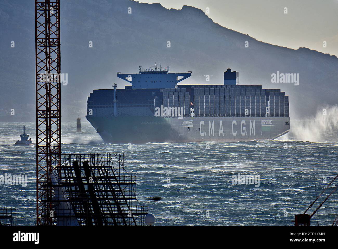 General view of the CMA CGM Palais Royal turning around in the harbor of Marseille. The container ship Palais Royal makes a passage through Marseille harbor for the first time before resuming its route to the port of Fos-sur-Mer for refueling. The CMA CGM Palais Royal is one of the largest container ships in the world powered by liquefied natural gas (LNG). Stock Photo