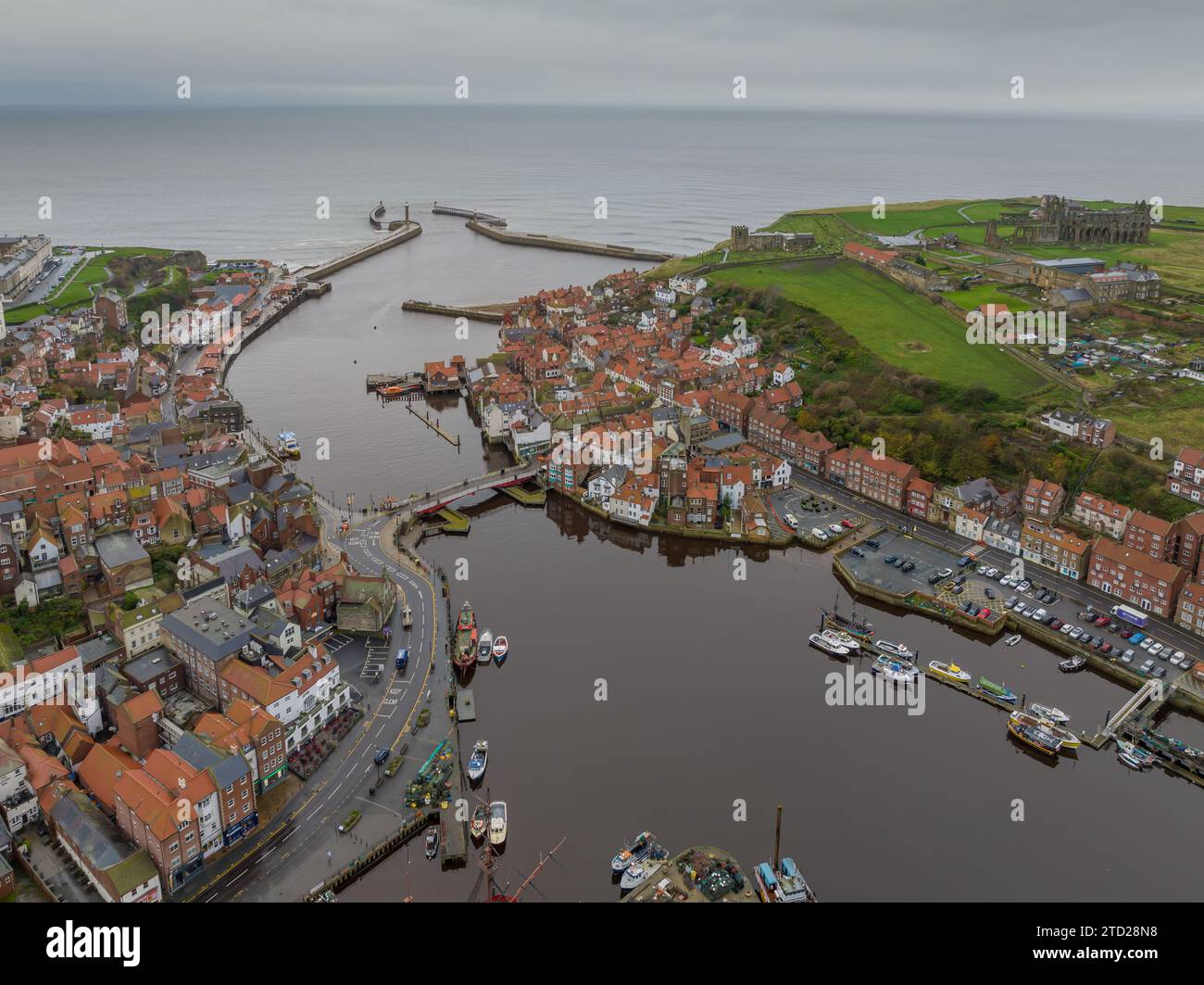 Whitby, North Yorkshire. Aerial View of the town and harbour featuring ...