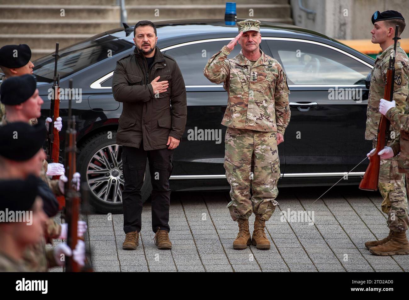 Wiesbaden, Germany. 14 December, 2023. Ukrainian President Volodymyr Zelenskyy, left, and Gen. Christopher Cavoli, commander U.S. Army Europe and Africa stand at attention for the national anthem during arrival ceremonies, December 14, 2023 in Wiesbaden, Germany. Credit: Susanne Goebel/US Army Photo/Alamy Live News Stock Photo