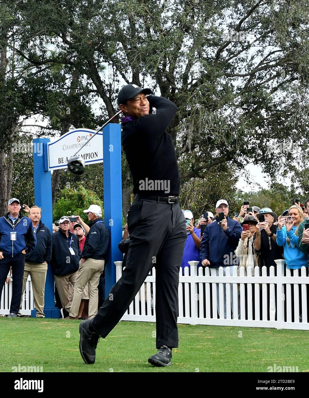 Tiger Woods hits a tee shot on the first hole of the ProAm at the PNC