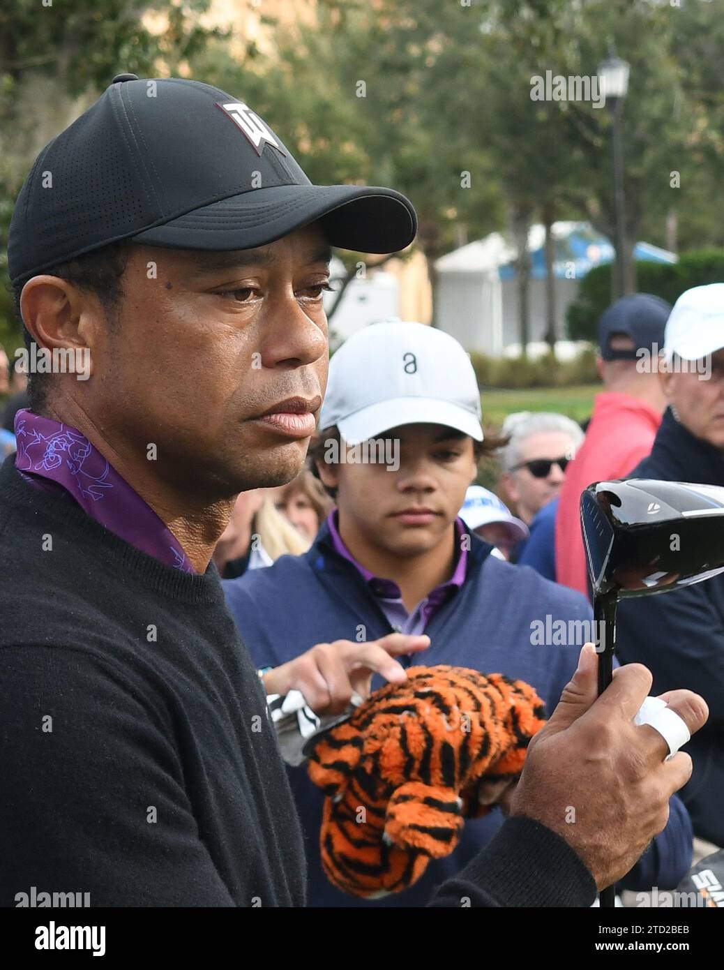 Tiger Woods and his son, Charlie Woods, arrive at the first hole to