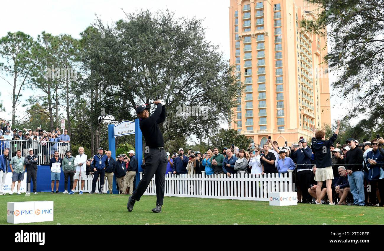 Tiger Woods hits a tee shot on the first hole of the ProAm at the PNC