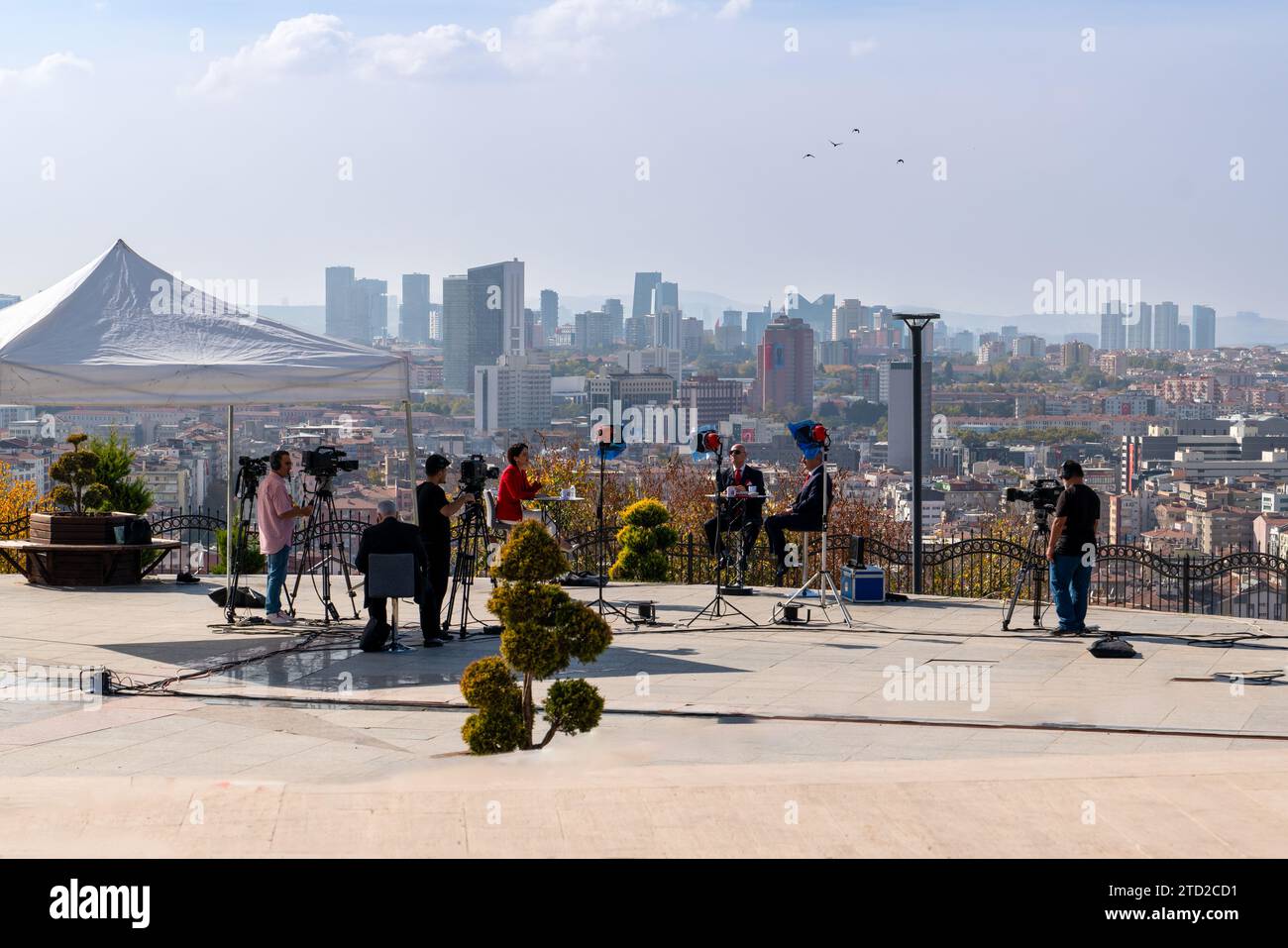 Ankara, Turkey - October 29, 2023: A live broadcast program outside in a park with the skyline of Ankara in the background Stock Photo