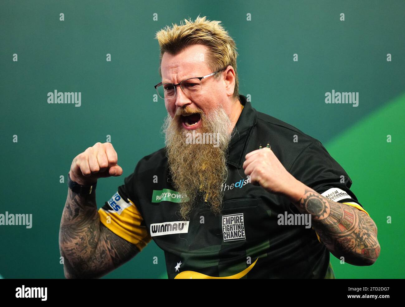 Simon Whitlock reacts after beating Paolo Nebrida (not pictured) on day