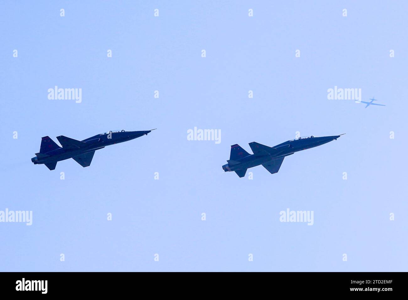Two T38 Talons fly below a U2 Dragon Lady at the California Capital
