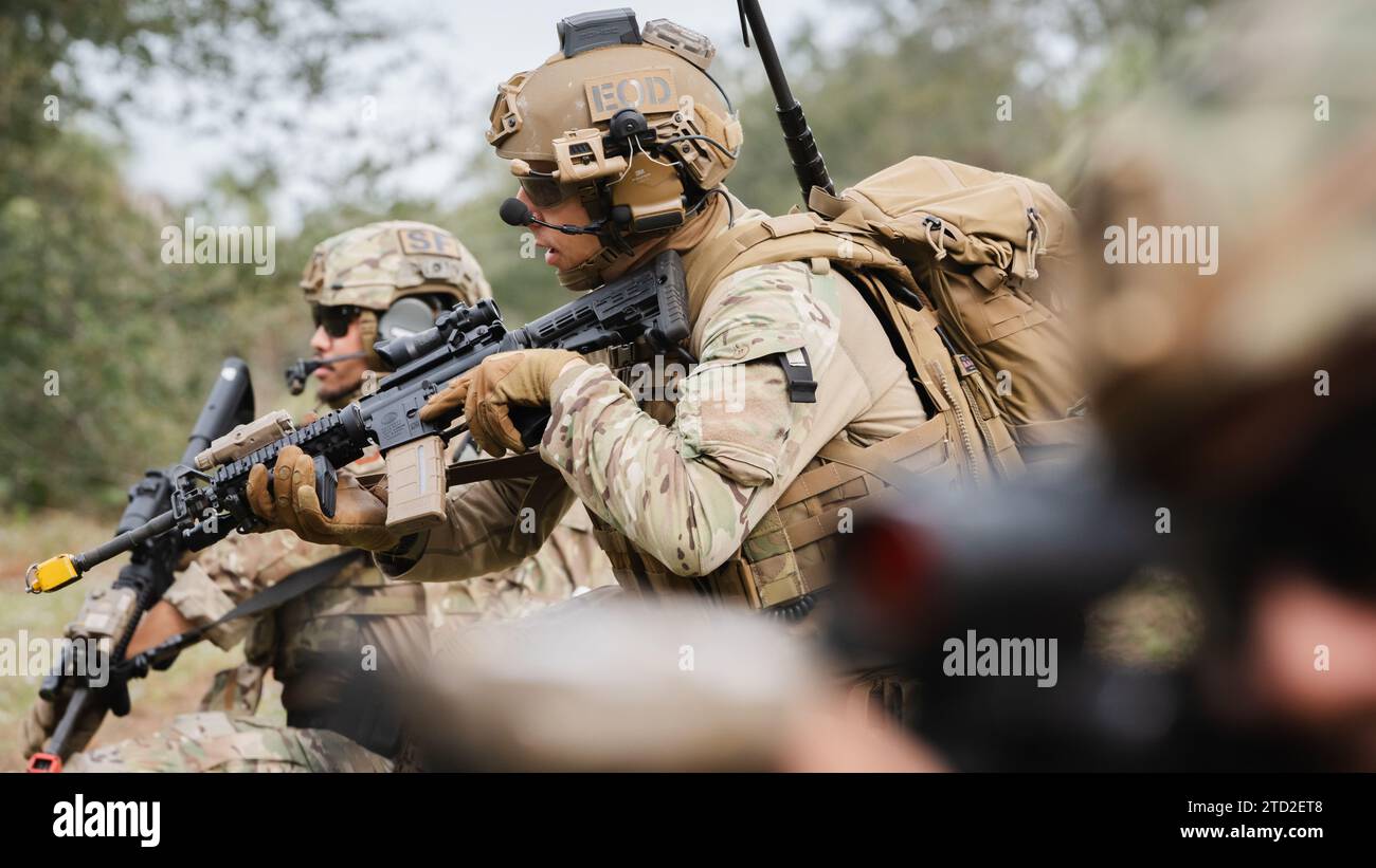 Airmen assigned to the 6th Civil Engineer Squadron explosive ordnance disposal flight and the 6th Security Forces Squadron participate in a dismounted exercise at MacDill Air Force Base, Florida, Dec. 14, 2023. The 6th CES EOD flight and 6th SFS conducted a four-day training course to familiarize Airmen with practical integrated tactics and prepare them for potential threats in which both units would respond. (U.S. Air Force photo by Senior Airman Joshua Hastings) Stock Photo