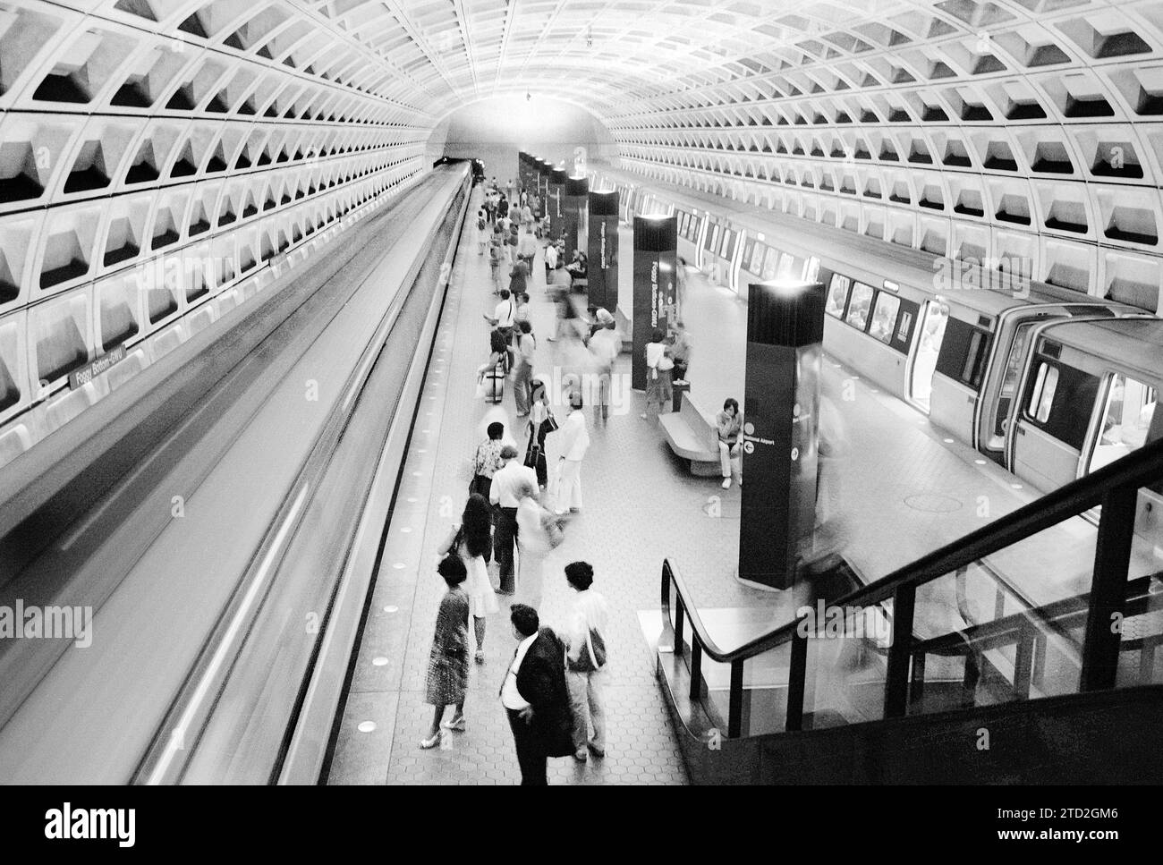 Commuters on train platform with train at Foggy Bottom Metro Station, Washington, D.C., USA, Marion S. Trikosko, U.S. News & World Report Magazine Photograph Collection, July 10, 1979 Stock Photo