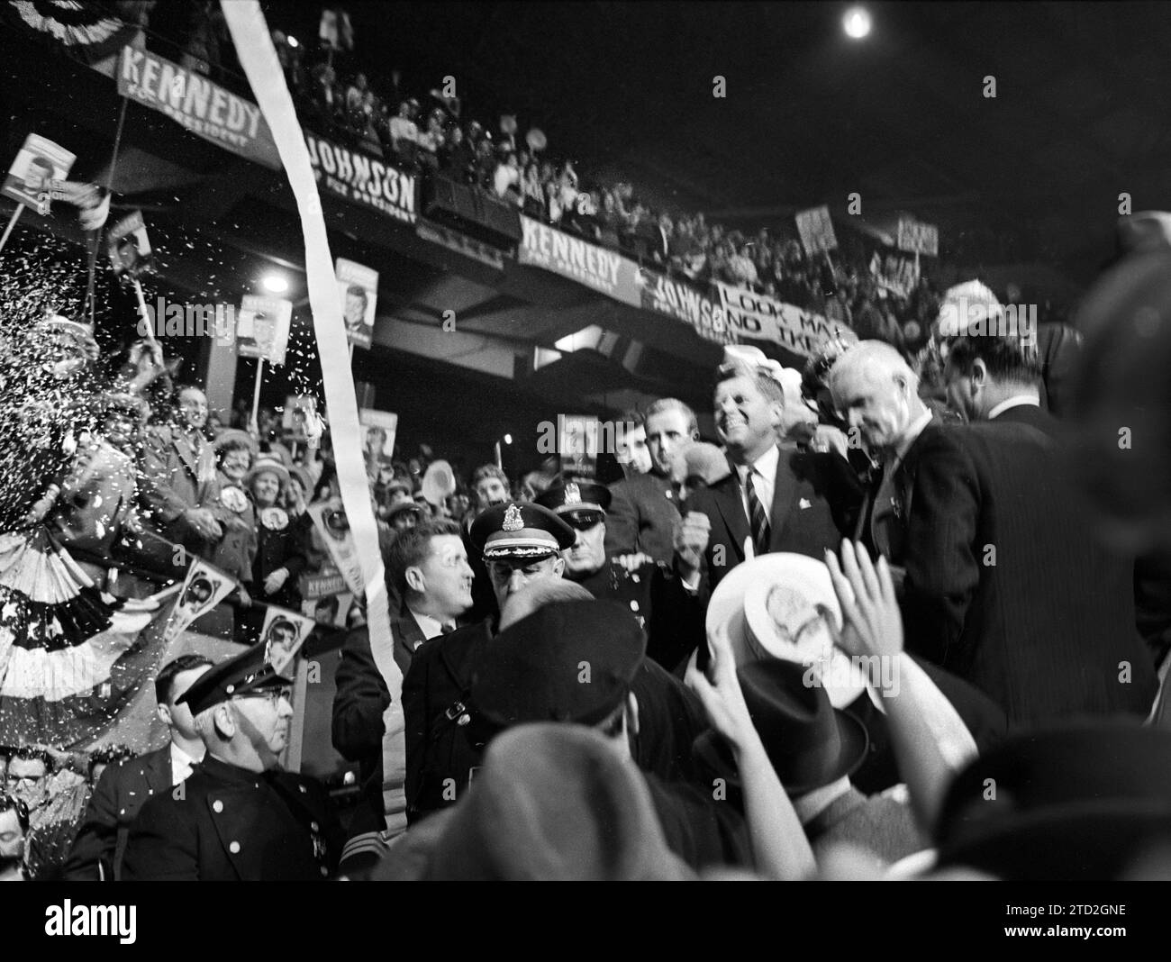 U.S. Senator John F. Kennedy surrounded by cheering supporters at Boston Garden on night before election day, Boston, Massachusetts, USA, Marion S. Trikosko, U.S. News & World Report Magazine Photograph Collection, November 7, 1960 Stock Photo