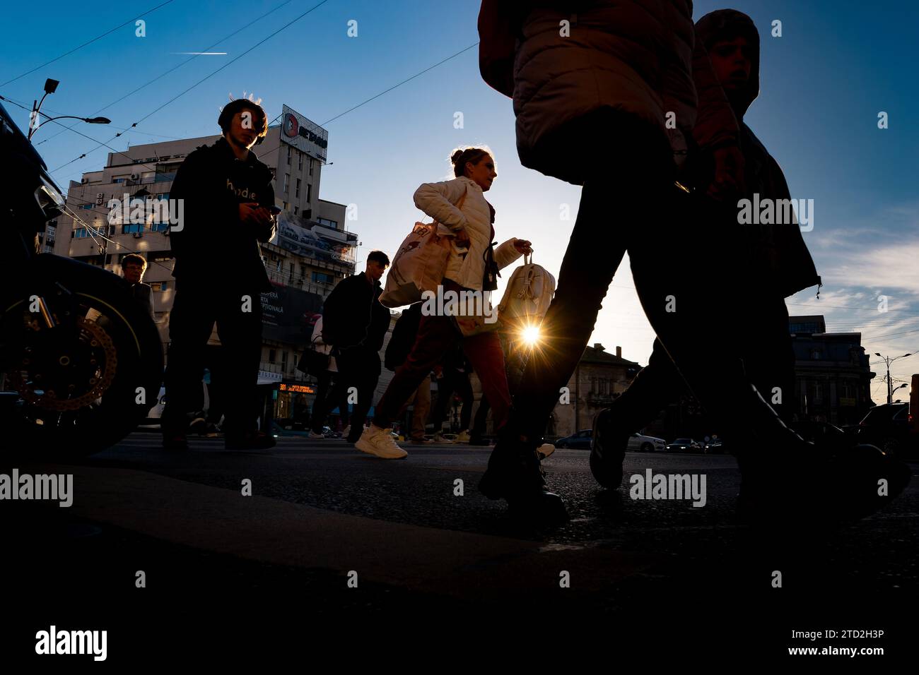 Bucharest, Romania - November 14, 2023: People cross the street in ...