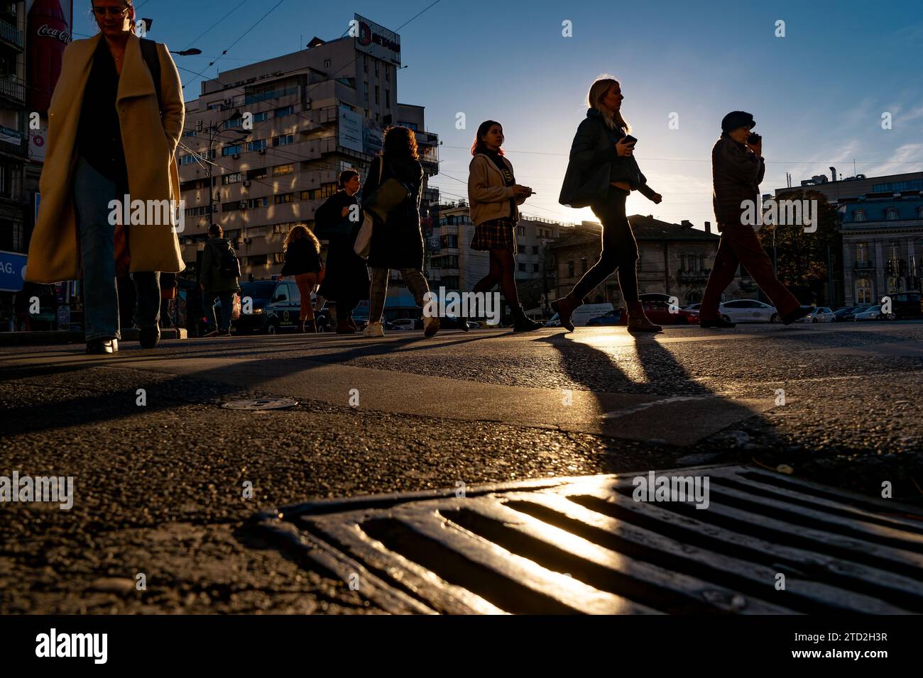 Bucharest, Romania - November 14, 2023: People cross the street in ...
