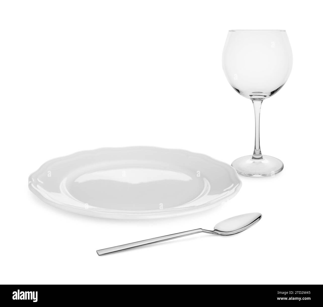 Clean plate, spoon and glass on white background Stock Photo