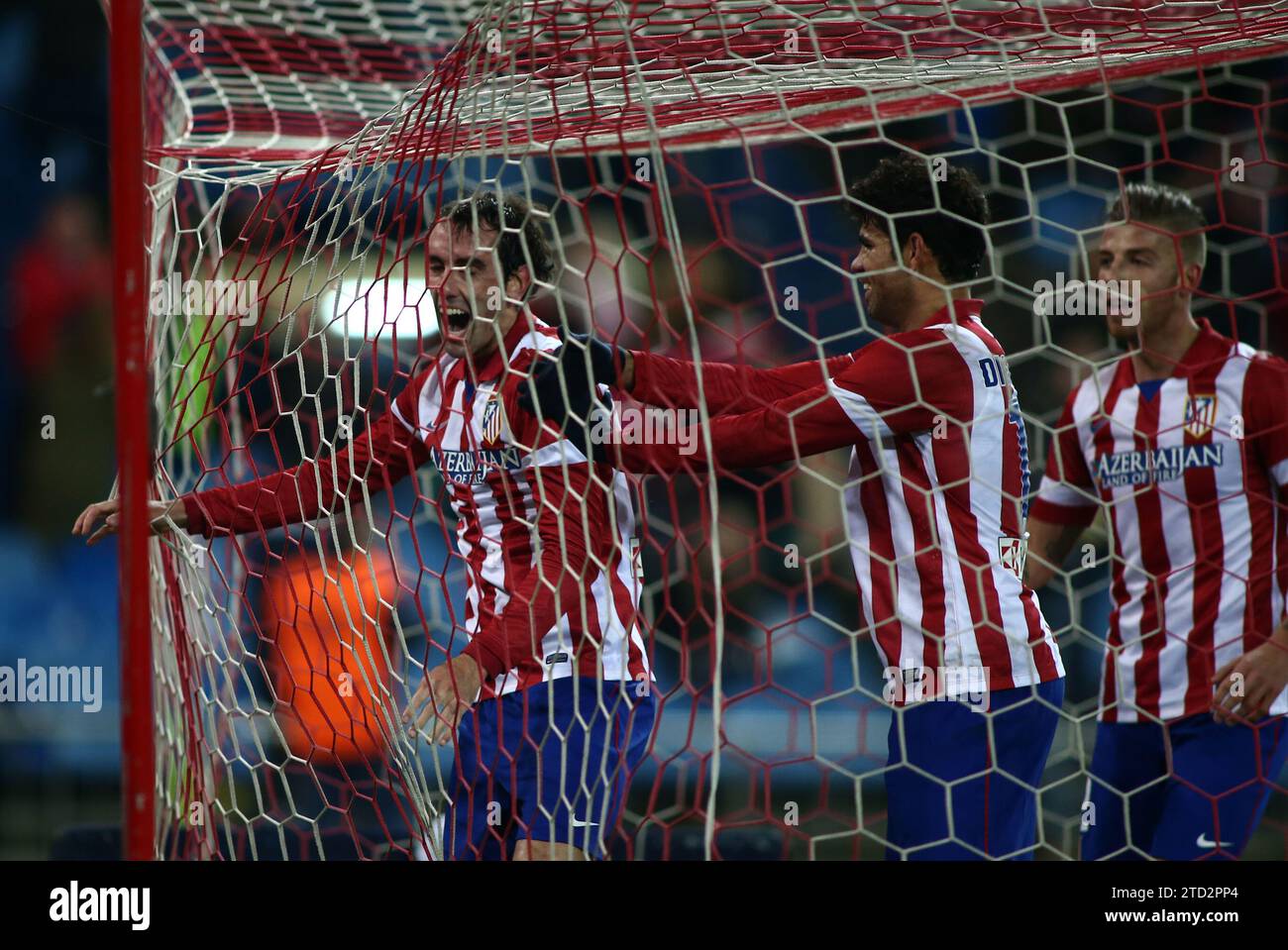 MADRID. January 23, 2014. Diego Godin scores and celebrates the goal during the Copa del Rey match between Atletico de Madrid and Athletic Bilbao at the Vicente Calderon stadium. Image Oscar del Pozo ARCHDCGodín, scorer of Atlético's goal, is congratulated by Diego Costa and Alderweireld. Credit: Album / Archivo ABC / Oscar del Pozo Stock Photo