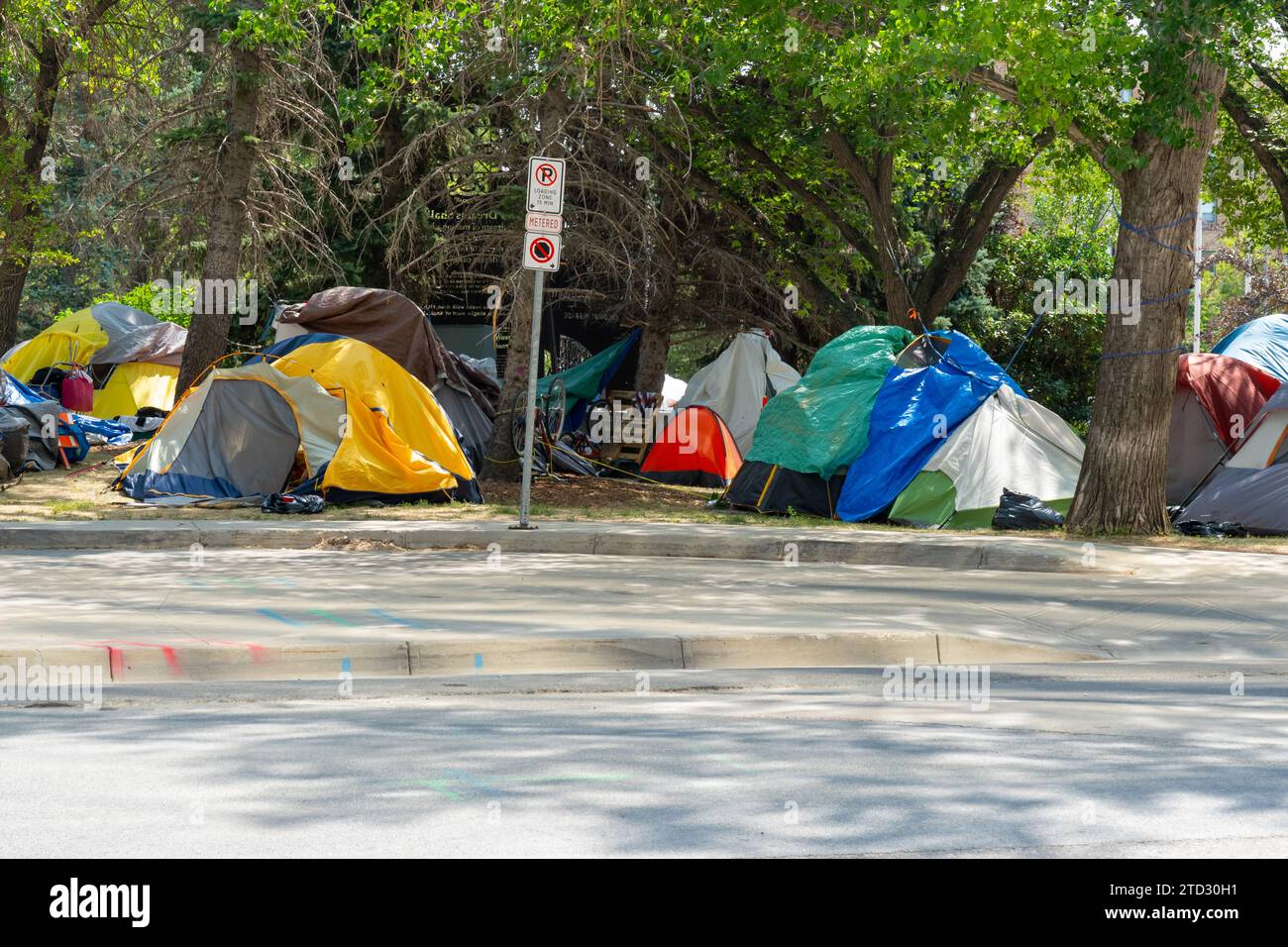 Homeless tent encampment under the trees in downtown.  Regina, Saskatchewan, Canada Stock Photo