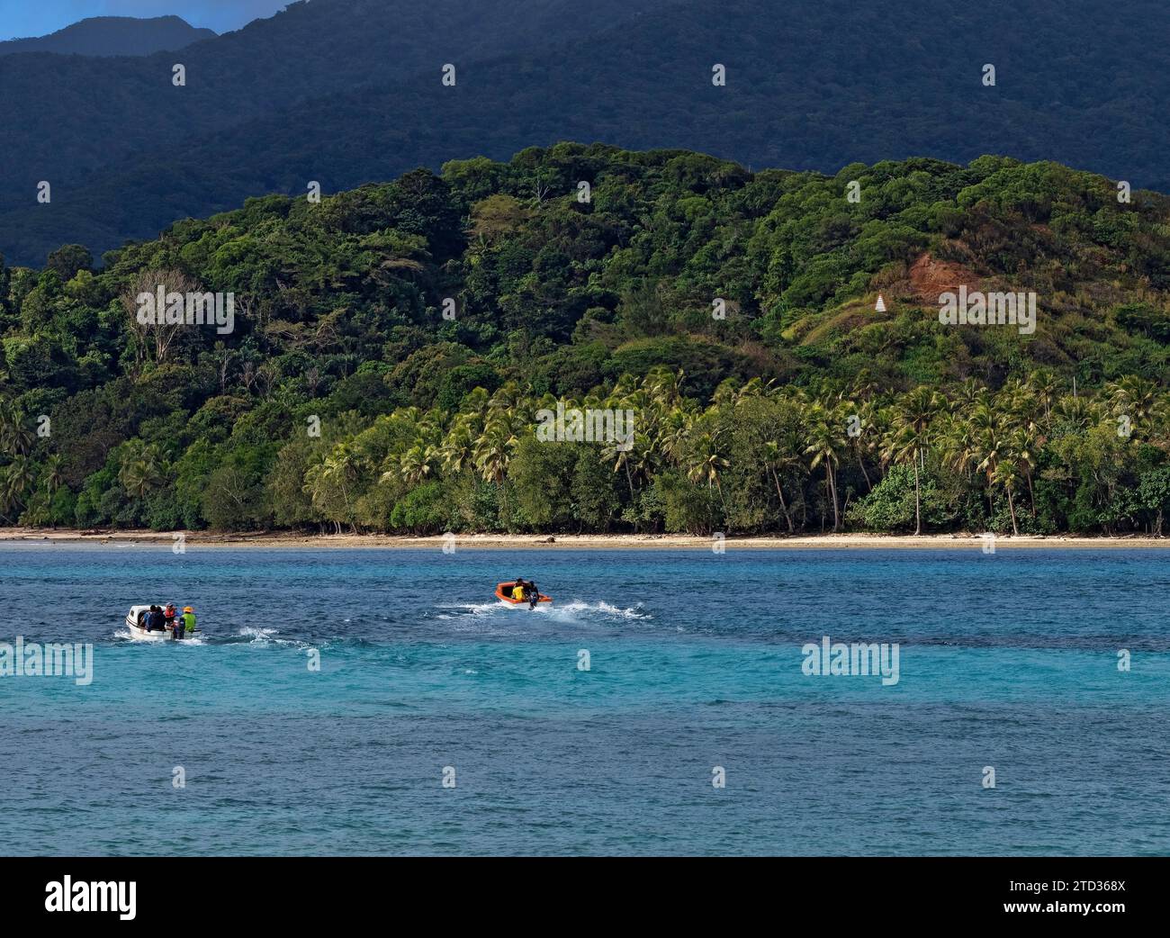 South Pacific Cruise /  Aneityum tour guides  return to Aneityum Isalnd after Cruise ship passengers  from Carnival Splendor  depart Mystery Island.Af Stock Photo