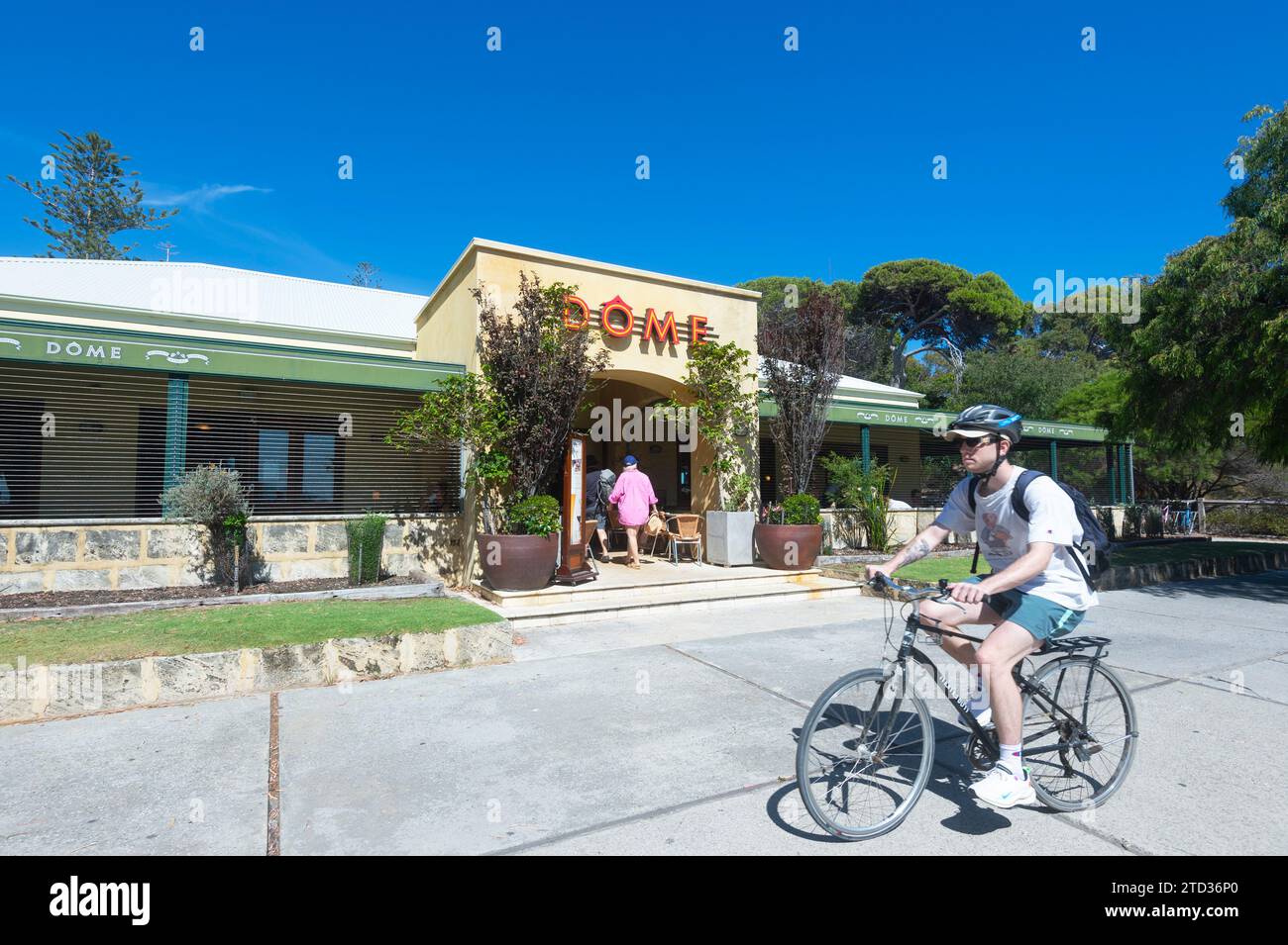 Cyclist in front of the popular Dôme restaurant on Rottnest Island or Wadjemup, Western Australia, Australia Stock Photo