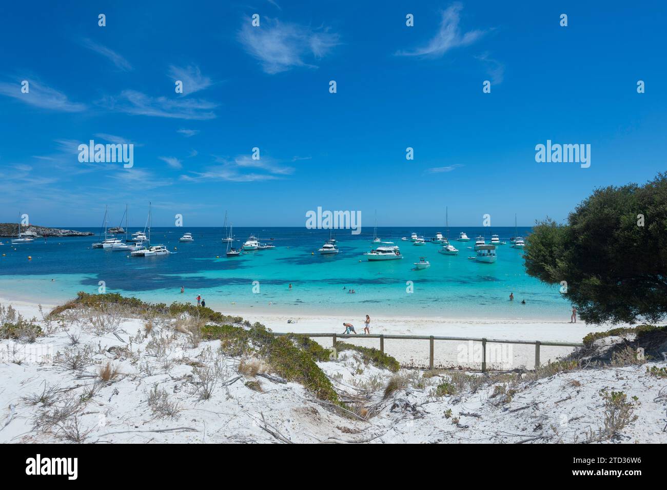Yachts anchored in turquoise waters on an idyllic beach of the Indian Ocean, Rottnest Island or Wadjemup, Western Australia, Australia Stock Photo