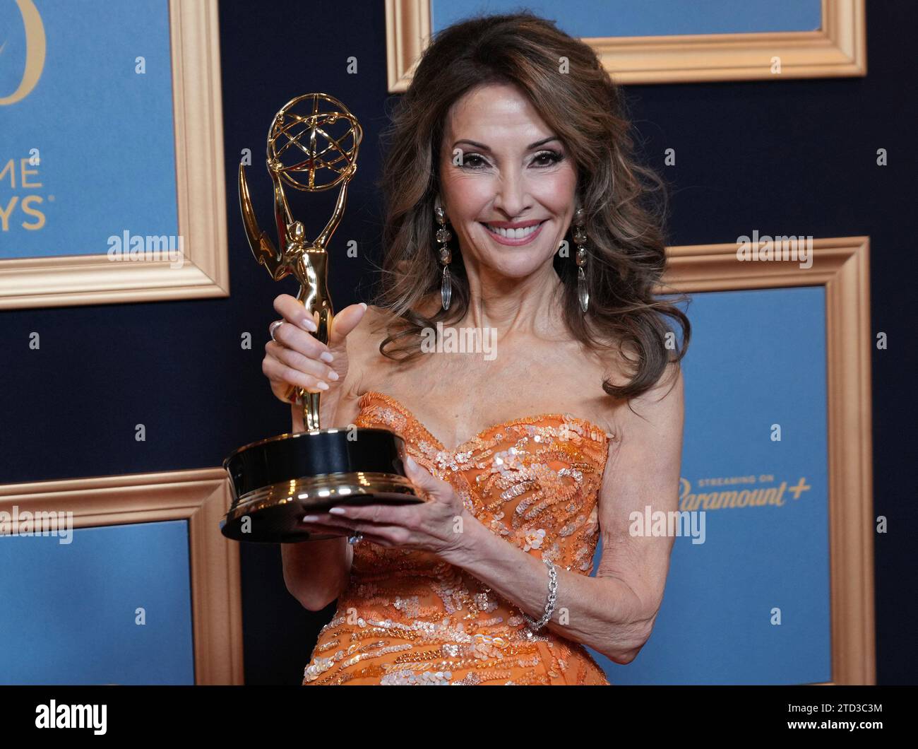 Susan Lucci poses with a "Lifetime Achievement Award" at the 50th