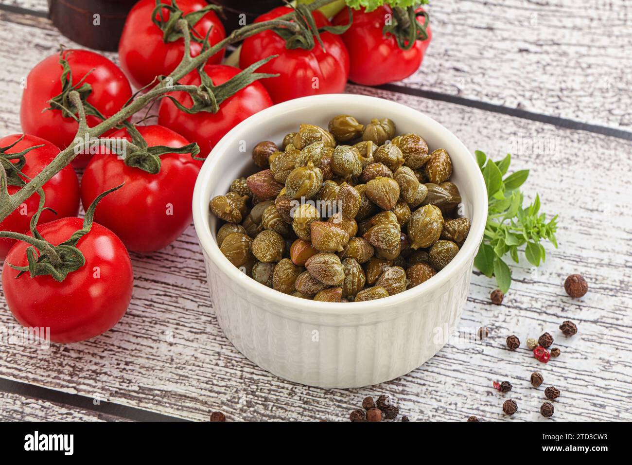 Marinated green capers condiment in the bowl Stock Photo - Alamy