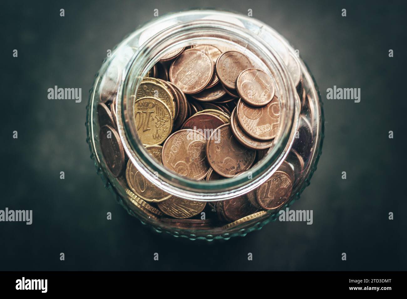 Glass jar full of money coins, euros. Stock Photo