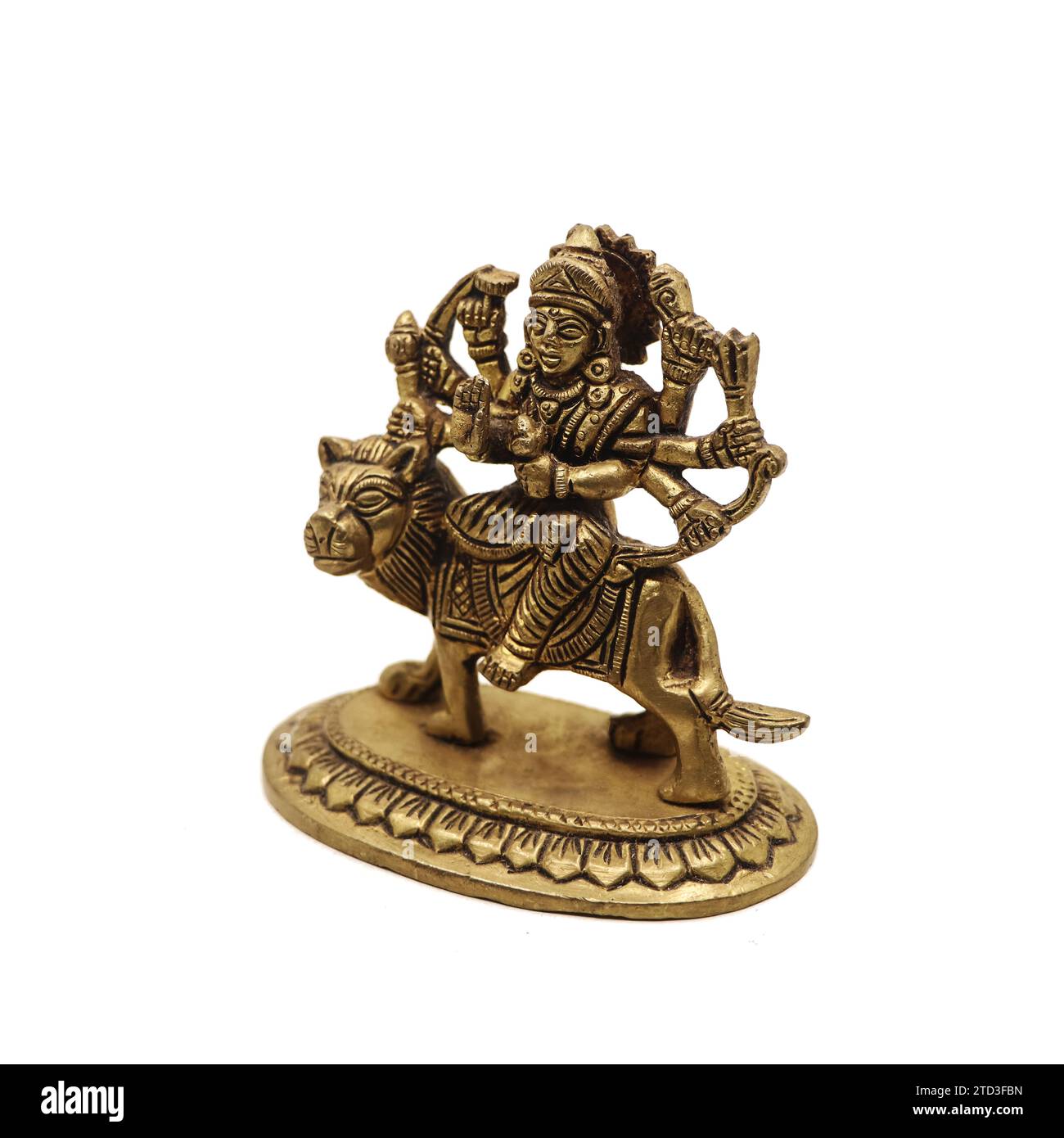 statue of goddess durga devi of hindu religion holding multiple weapons in her many arms, sitting on her lion Stock Photo