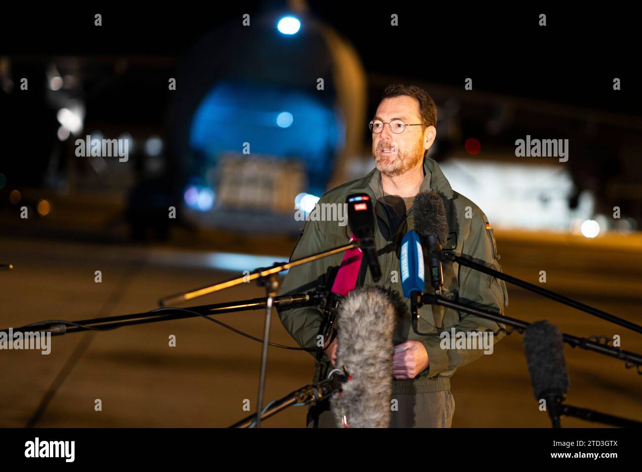 16 December 2023, Lower Saxony, Wunstorf: Colonel Christian John, Commodore Air Transport Wing 62 of the German Air Force, gives an interview on the grounds of Wunstorf Air Base. At the weekend, the air force is transporting medical supplies from Germany to Egypt on behalf of the German Foreign Office. These include incubators and ventilators, which are needed there to treat patients and babies from the Gaza Strip. Photo: Michael Matthey/dpa Stock Photo