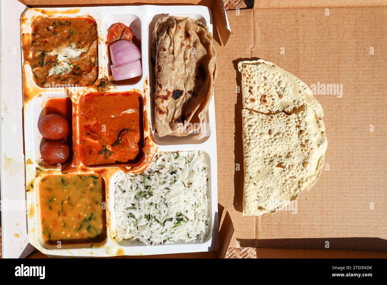 Punjabi thali in box. Indian lunch food parcel. Punjabi thaali of roti