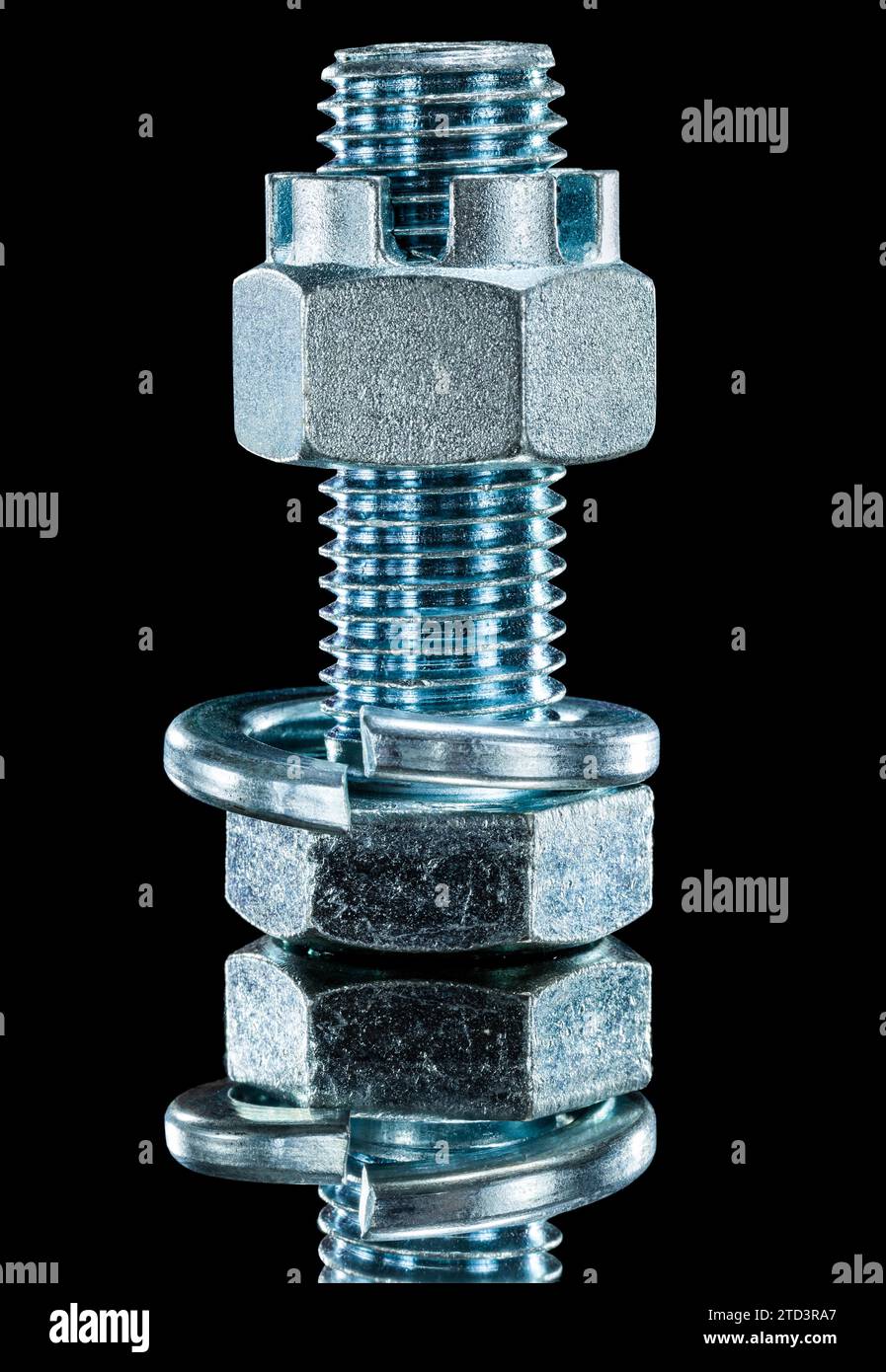 Construction nut screwbolt spring washer on black surface Stock Photo
