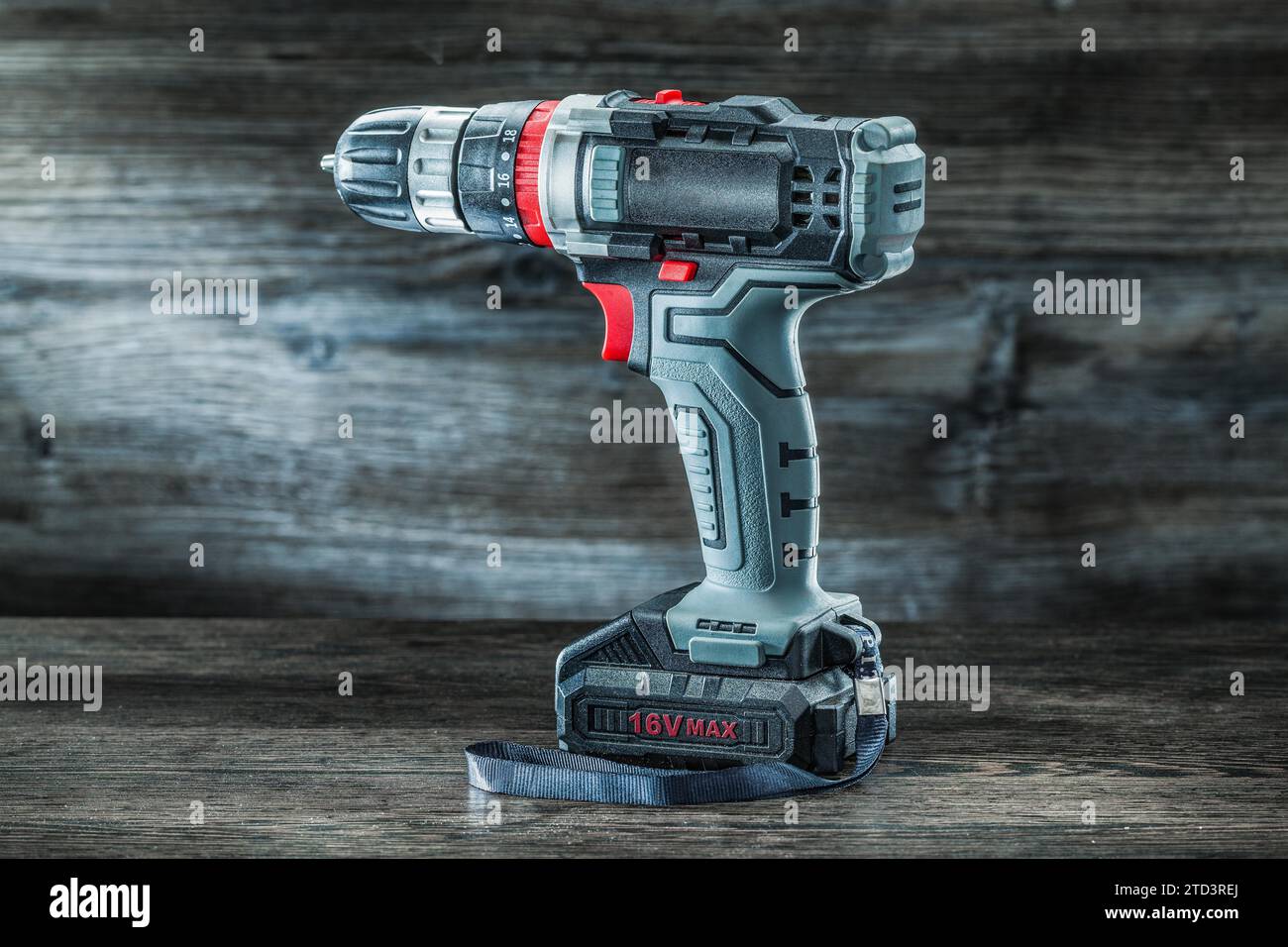 https://c8.alamy.com/comp/2TD3REJ/electric-tools-cordless-hand-drill-on-vintage-wooden-background-2TD3REJ.jpg