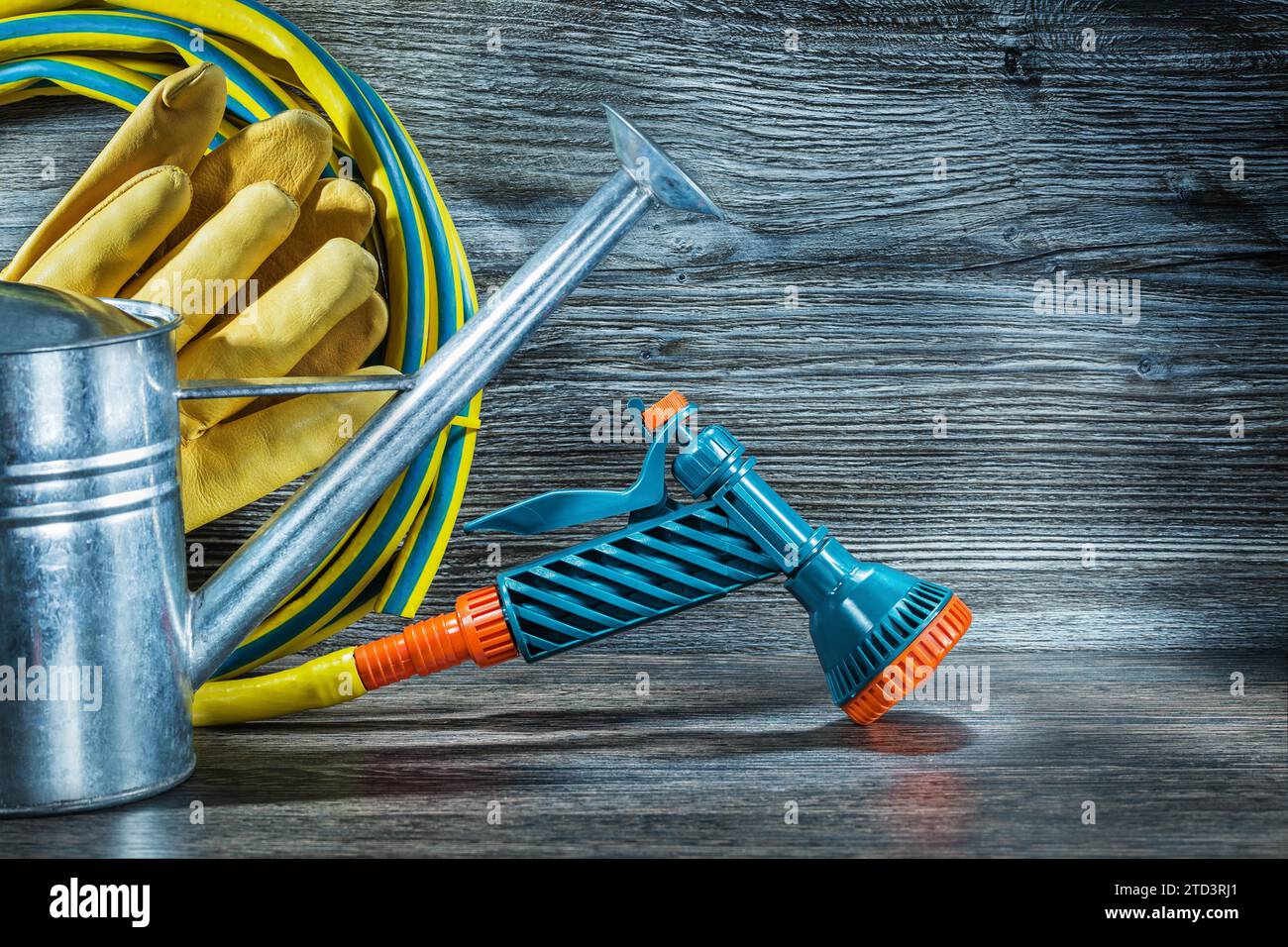 Agricultural watering can and watering hose with spray gan Stock Photo ...