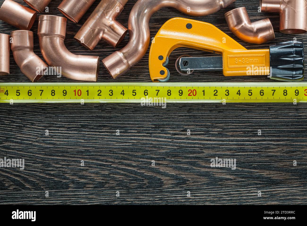 Copper water pipes measuring tape pipe scissors Stock Photo - Alamy