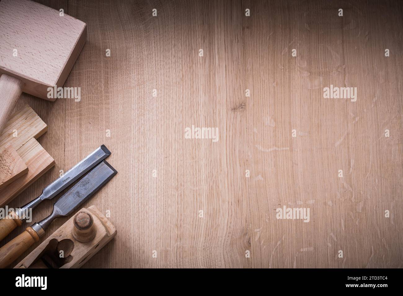 Copy space version of lump hammer planer metal chisels and wooden planks on wood board construction concept Stock Photo