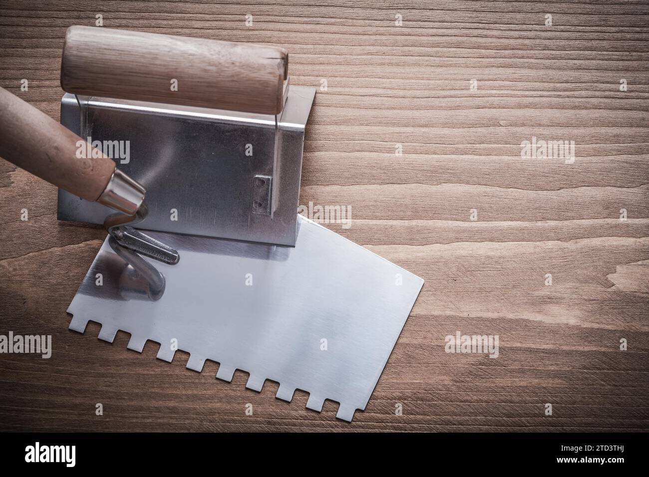 Putty knife and angle shaper with wooden handles Stock Photo Alamy
