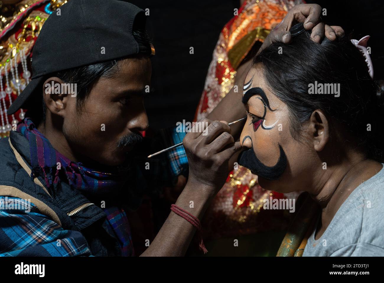 Guwahati, Assam, India on 15 December 2023. Artists gets make-up form a ...