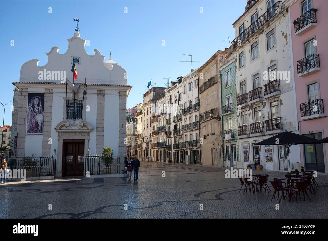 Capela de Nossa Senhora da Saude, on the right Old town houses in Rua da Mouraria, Lisbon, Portugal Stock Photo