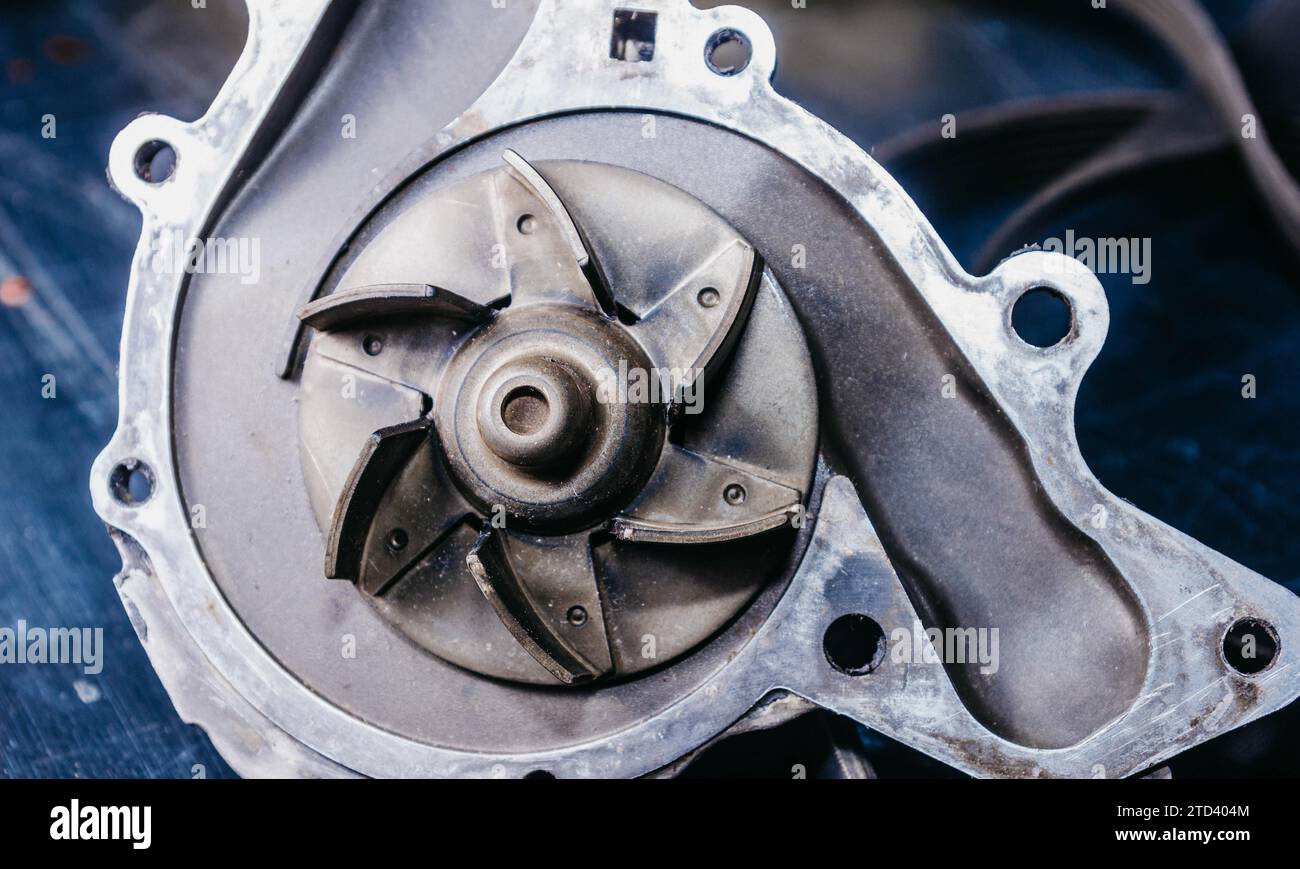 Concept of replacing the water pump of a car engine and drive belts