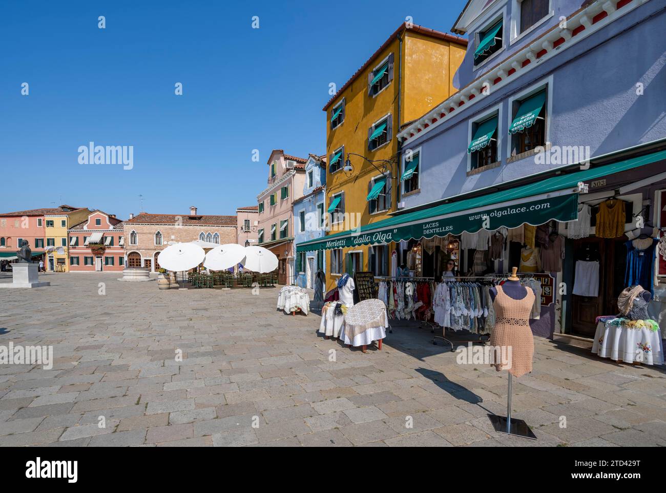 Clothes shop on the main square, Piazza Baldassare Galuppi, Burano Island, Venice, Veneto, Italy Stock Photo
