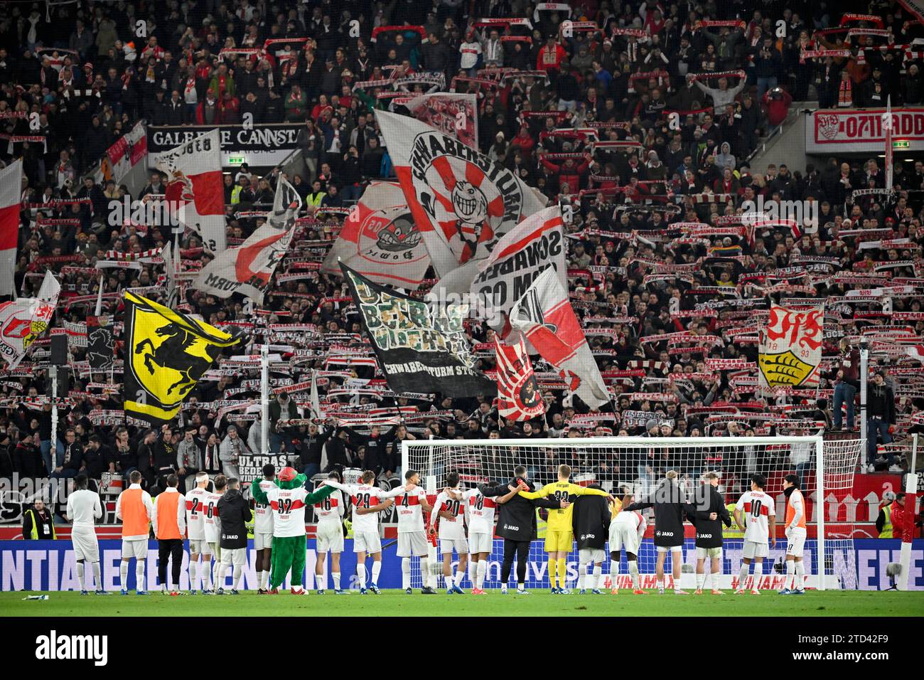 vfb-stuttgart-players-celebrate-cannstatter-kurve-fan-block-fans