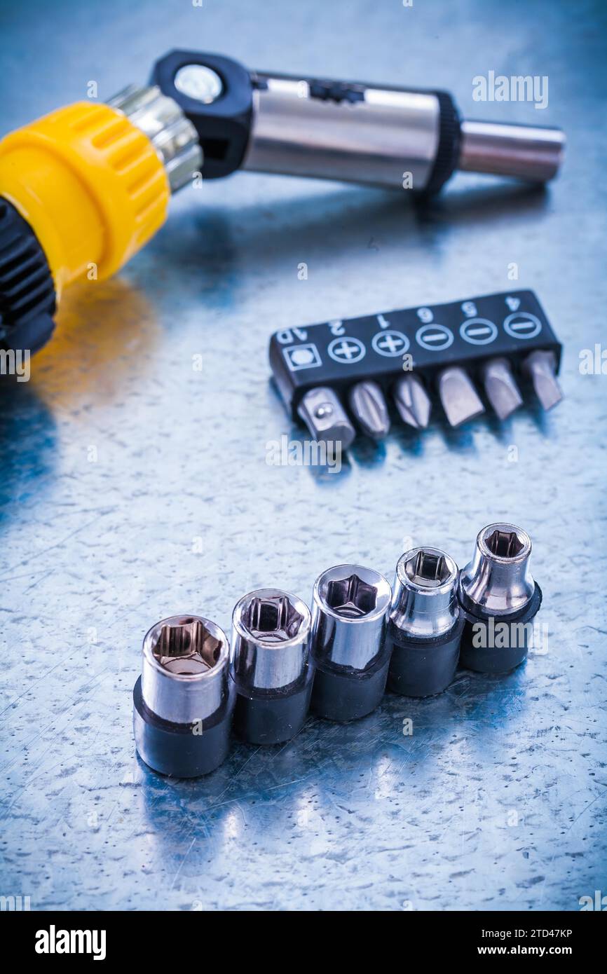 Vertical version of reversible screwdriver bits and Torx on a metallic