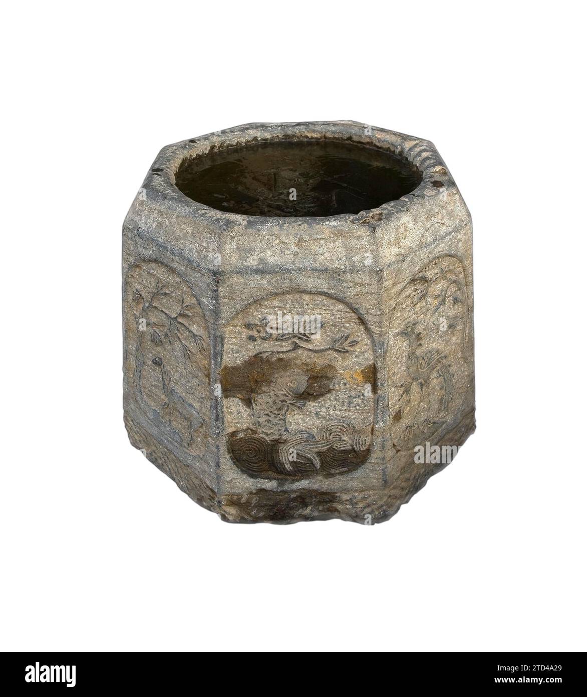 Ancient stone bucket finely carved with iced water over white backgroungd Stock Photo