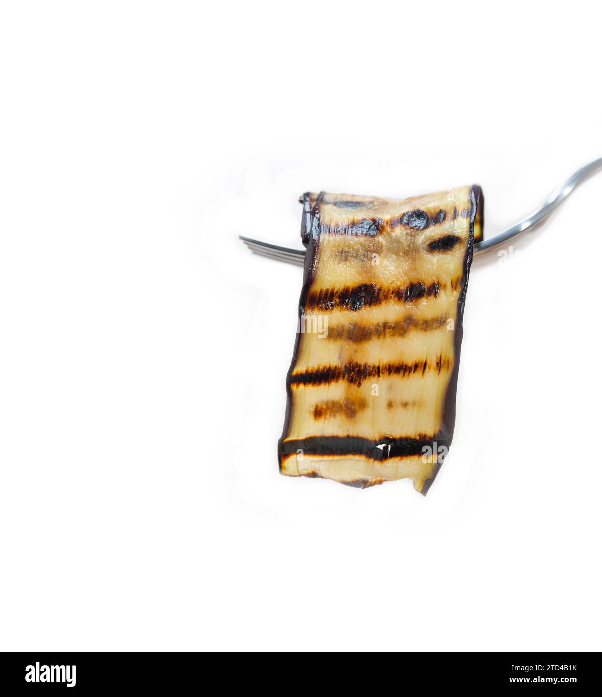 Grilled eggplant oubergine on a fork macro close up, food photography Stock Photo