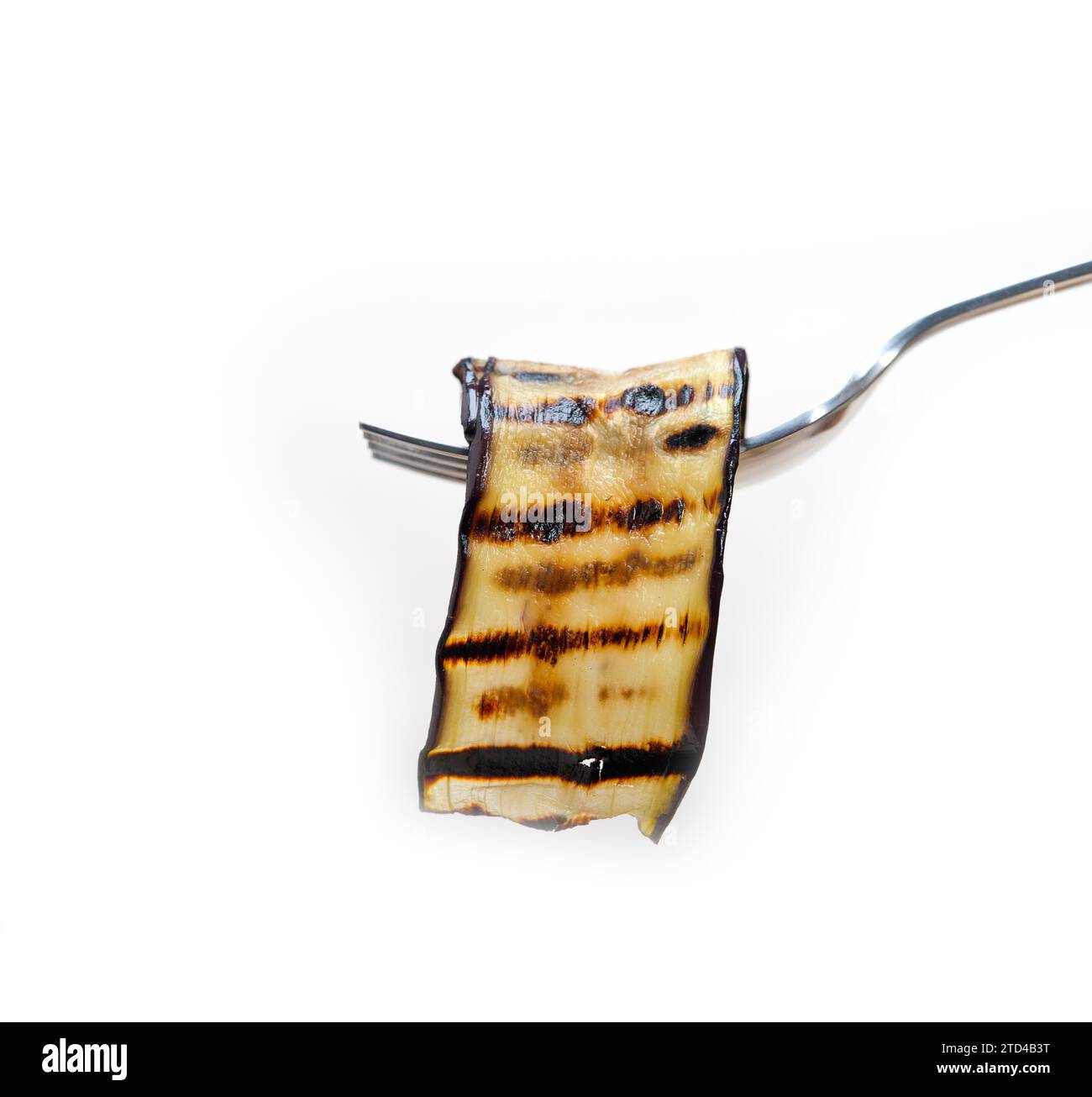 Grilled eggplant oubergine on a fork macro close up, food photography Stock Photo