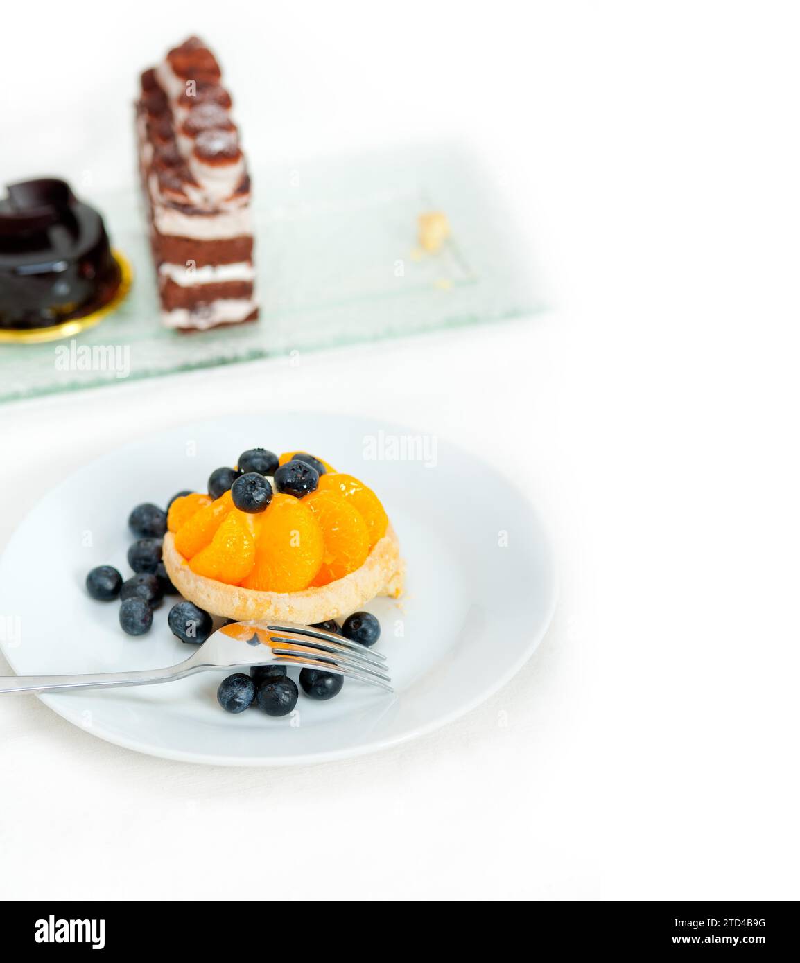Fresh blueberry and tangerine orange cream cupcake homemade closeup macro, food photography Stock Photo
